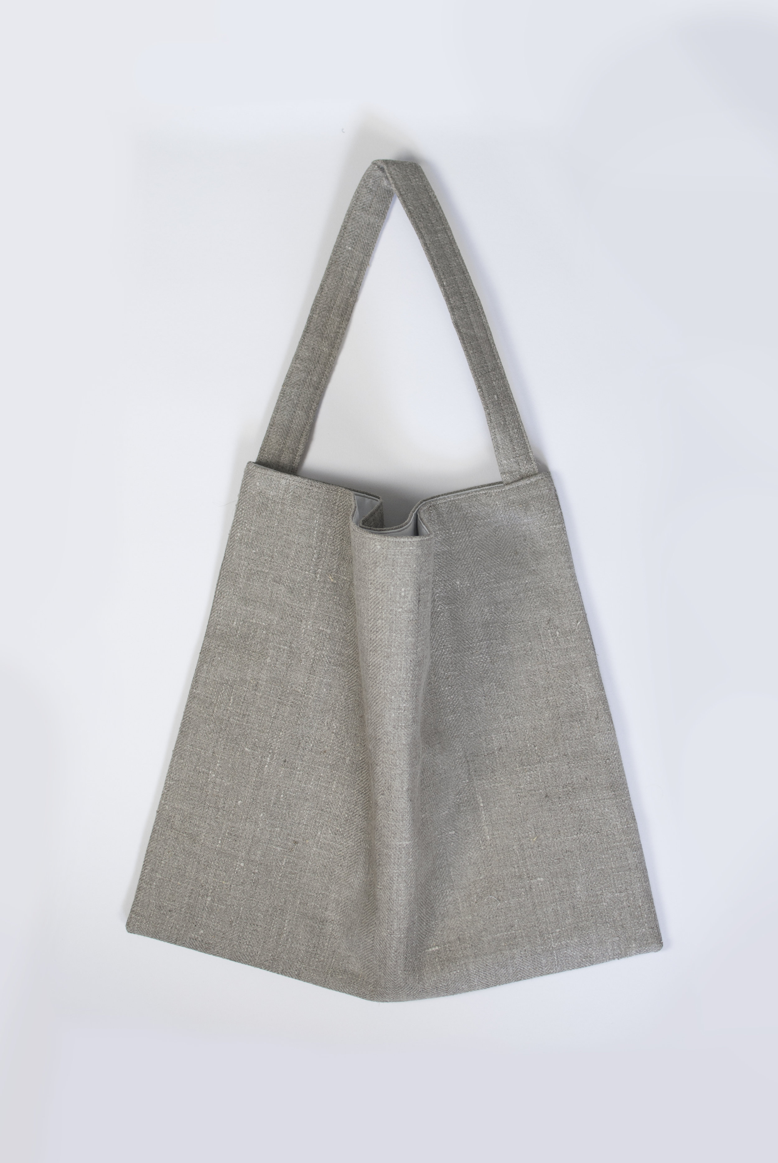Pared-back natural linen tote bag.