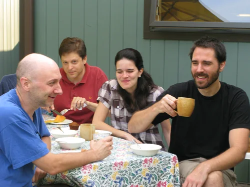 Students breaking bread together