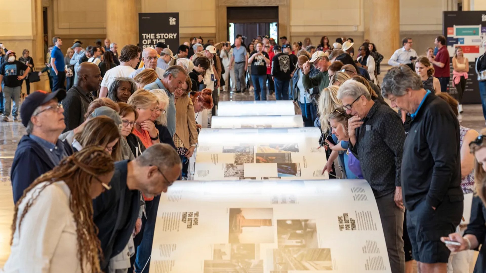 Craning their necks to take in every image, some guests spent over an hour poring over the exhibit.