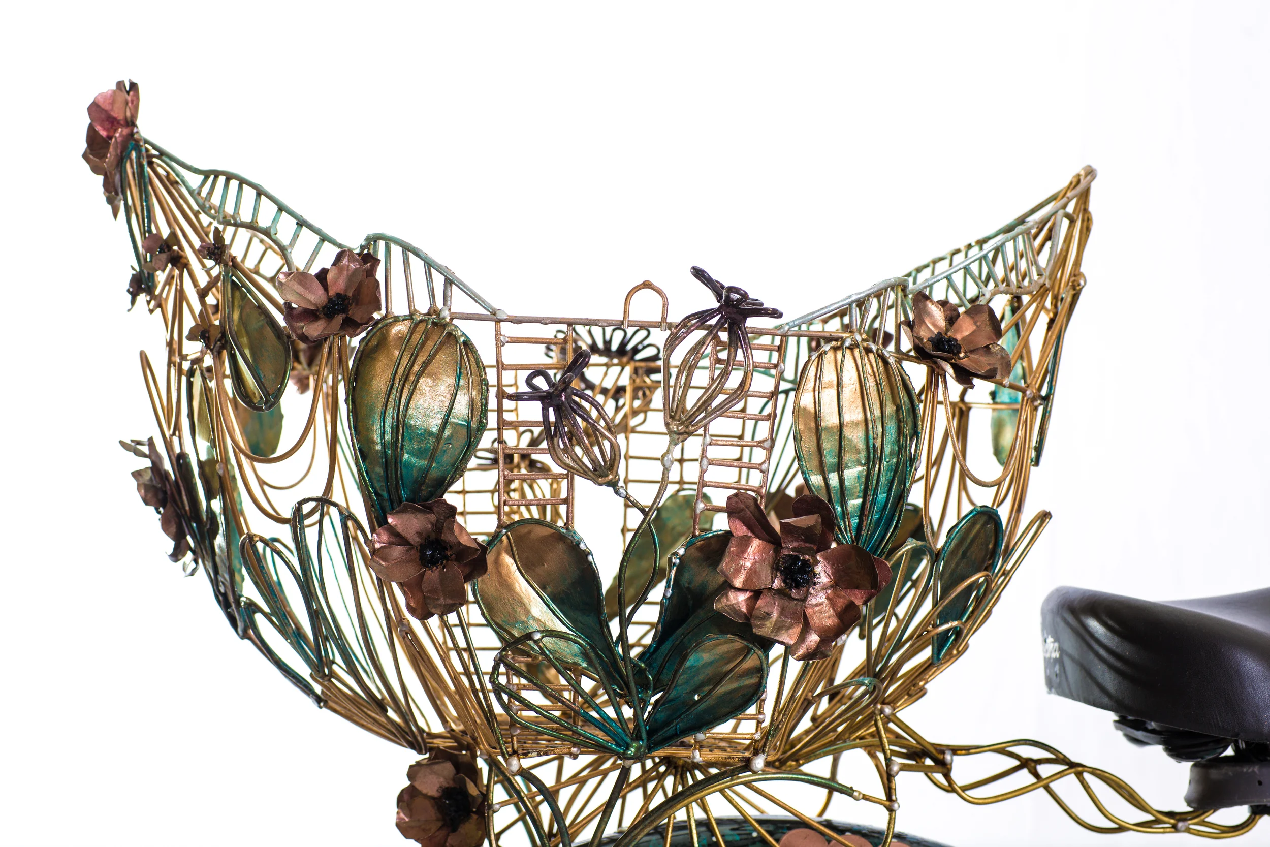  Artist's personal bike basket  Recycled mild steel wire fencing, recycled mild steel roofing. Shaped welded and hand painted with nail polish.  28” high x 22” wide x 19” wide  2014  Photo: Lee Orr 