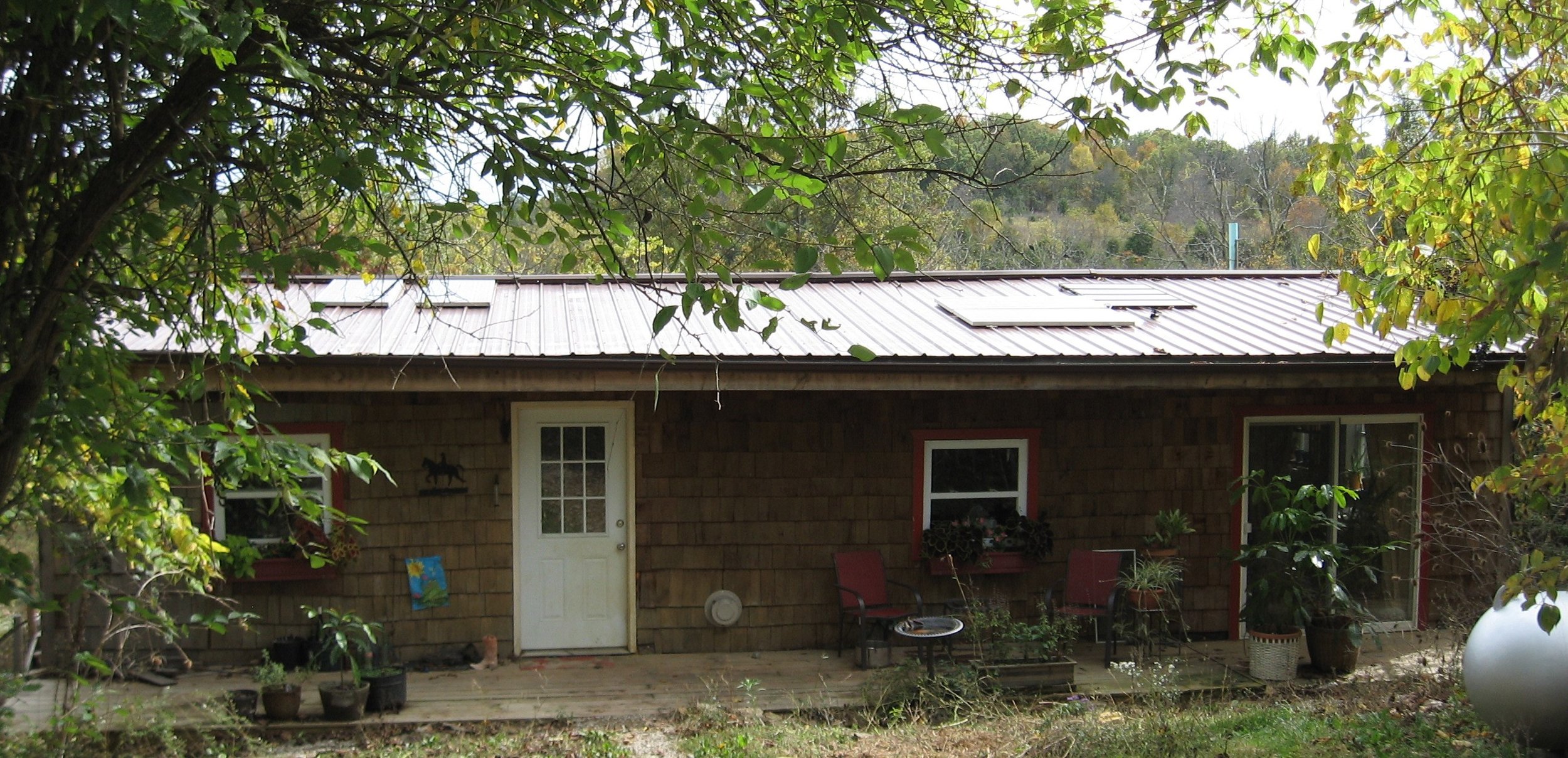 My metal roof supports my solar panels as well as a gutter system which leads to a cistern under the back porch. Fox Run Environmental Education Center