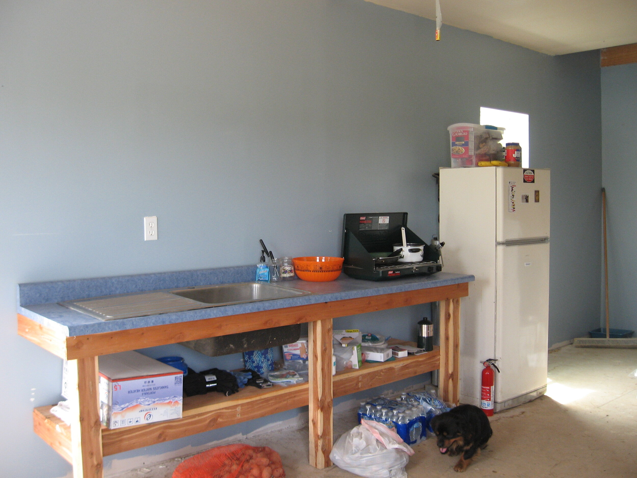 Workroom kitchen in my barn. Dometic propane fridge on right.
