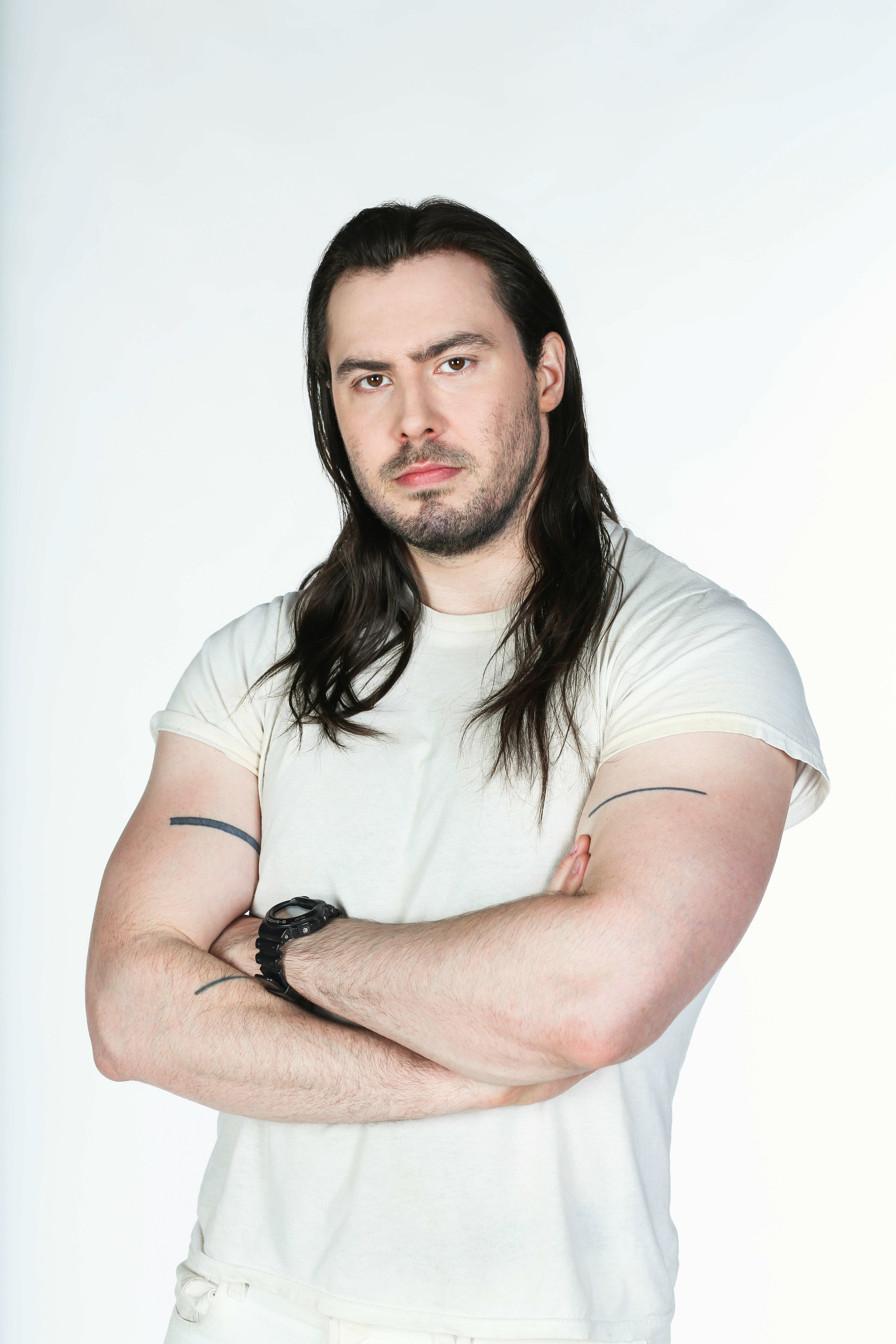 Andrew serious arms crossed.jpg