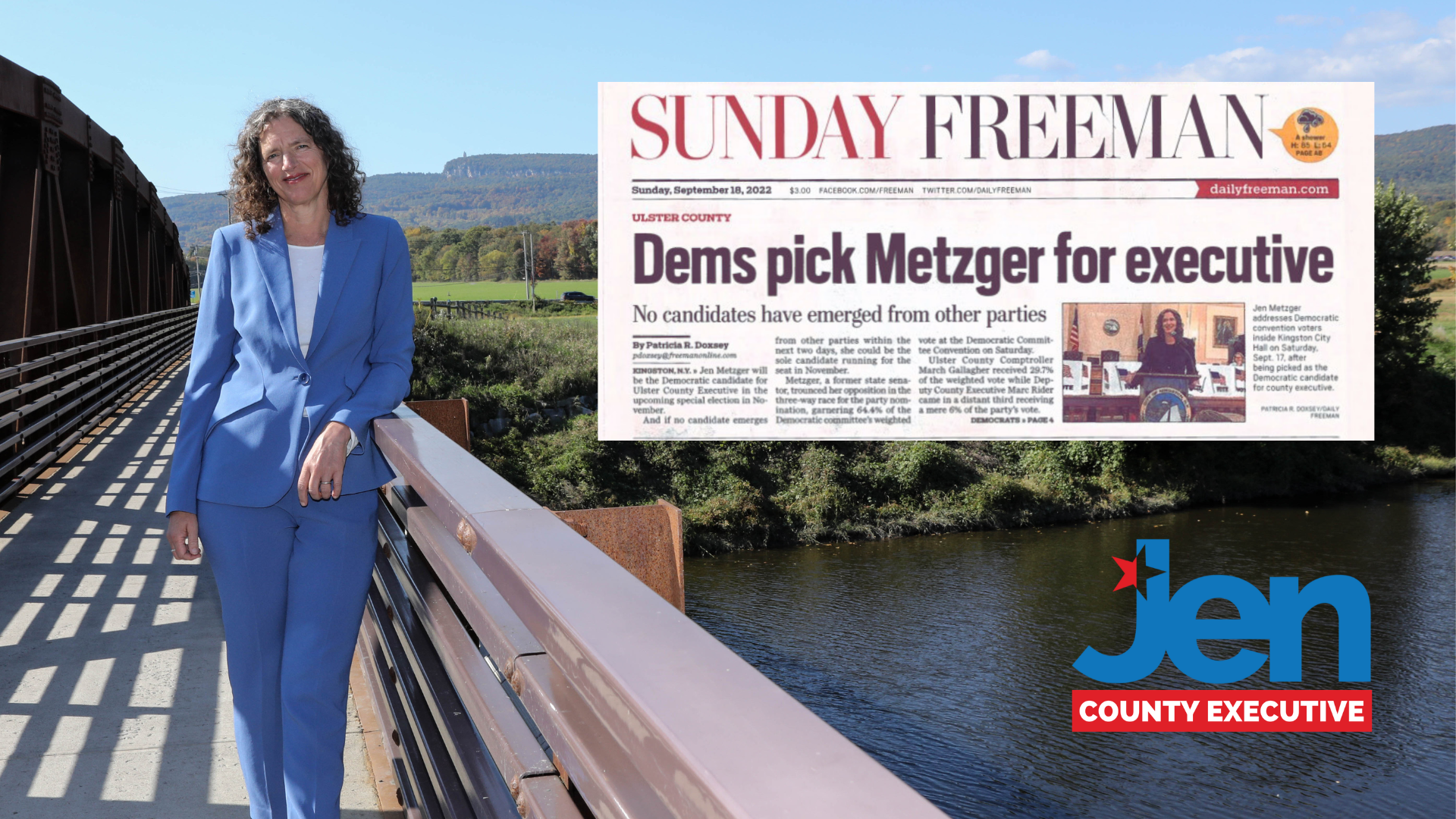 A woman in a blue suit standing on a bridge, with a river and green hills in the background. A newspaper headline with the text "Dems pick Metzger for executive" and a picture of Jen Metzger is overlaid on the image. A logo reading 'Jen County Executive' is in the bottom right corner.