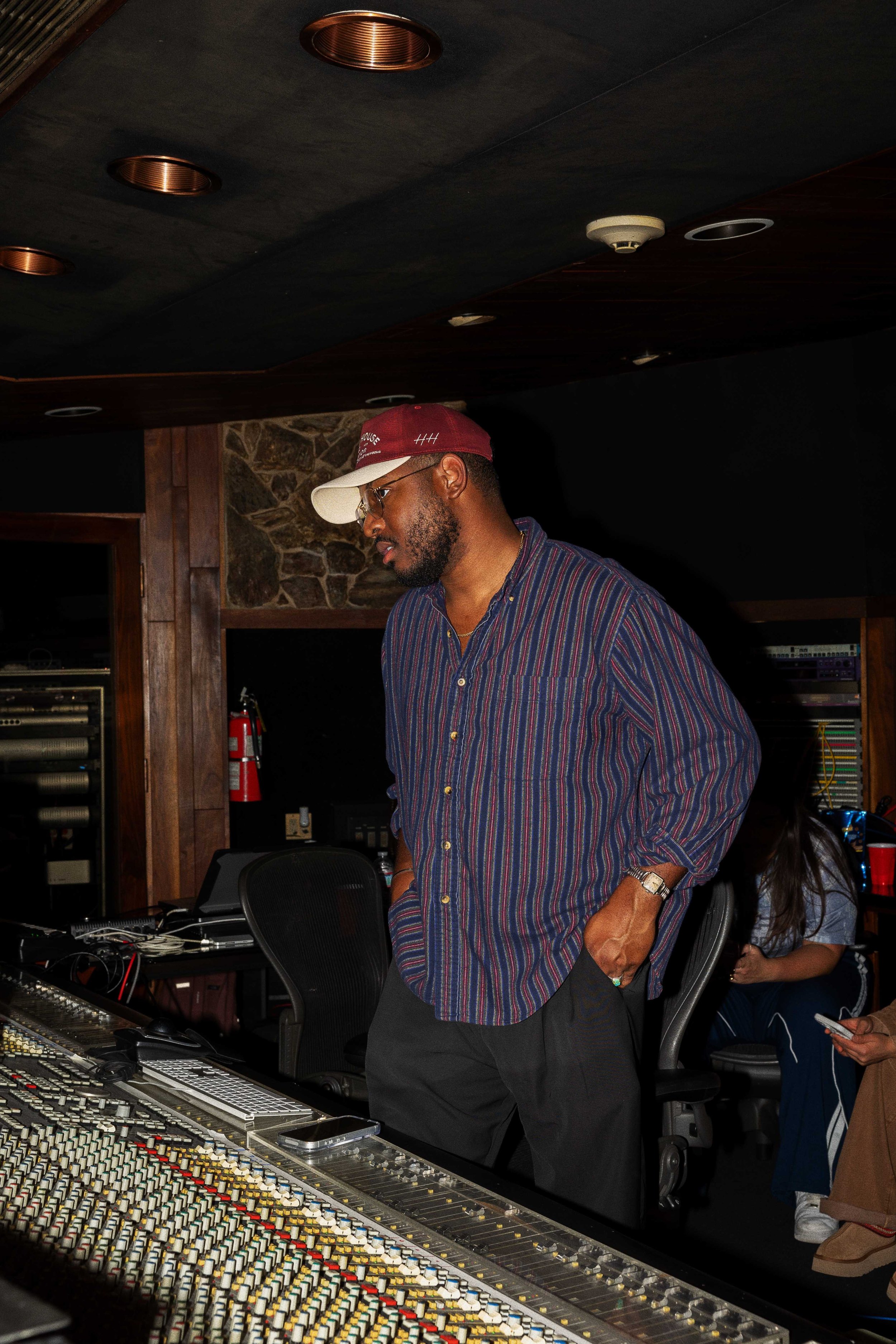 Ike Nichols standing at the mixing board in his Chicago recording studio