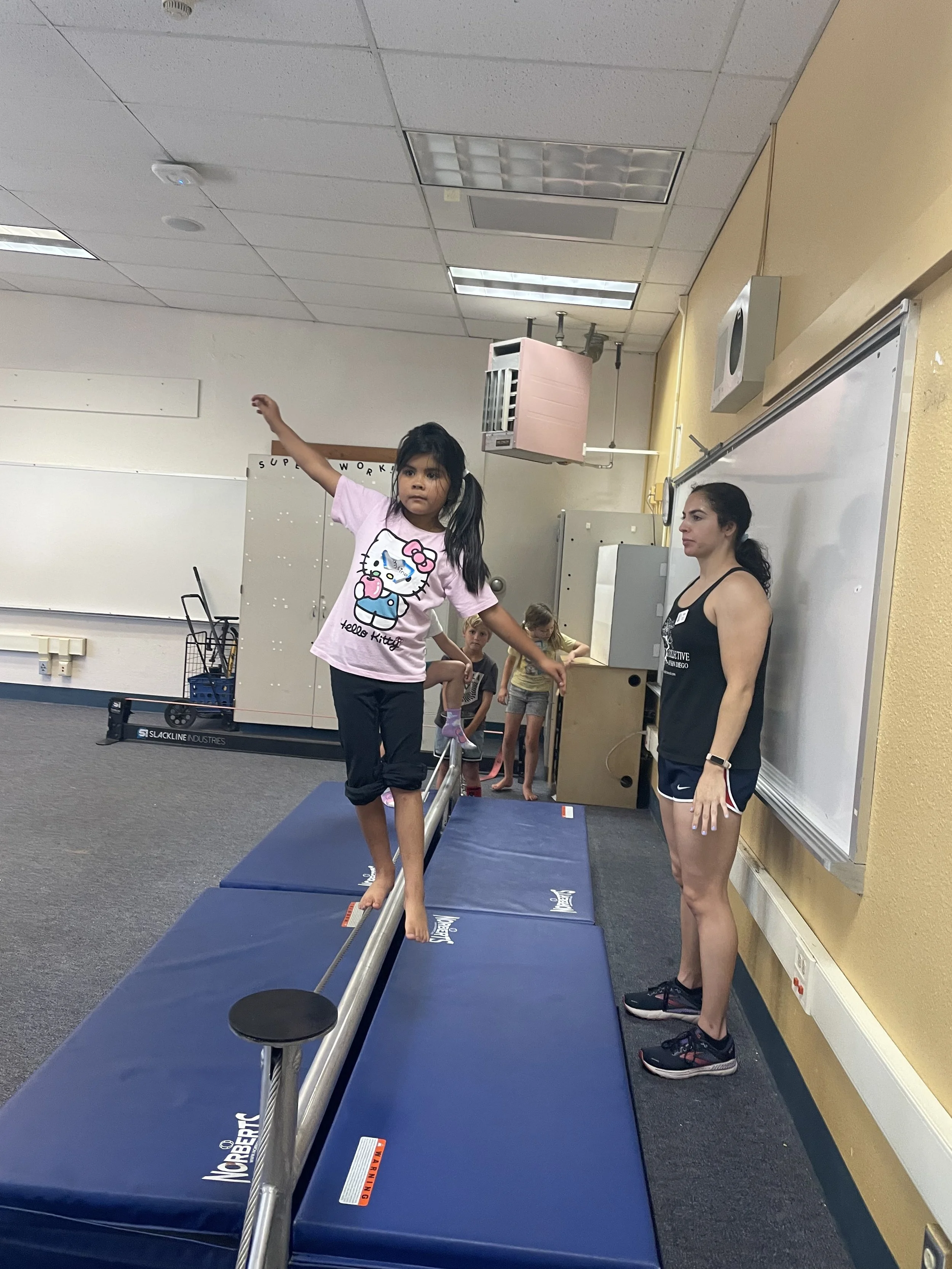 Valentina on tightwire w Gabby.jpg