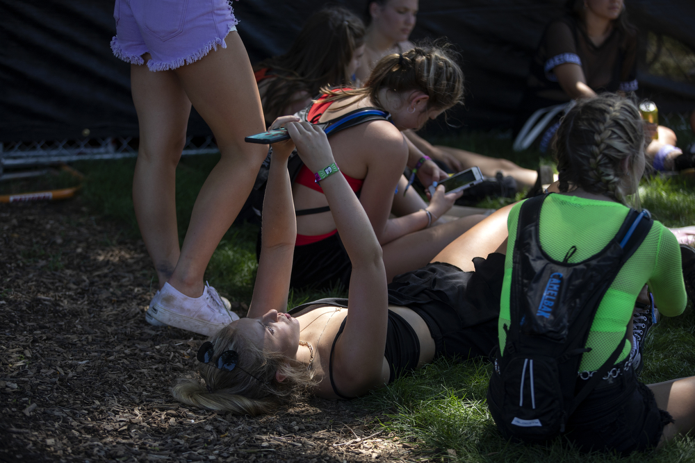 A festival goer takes a selfie with a cellphone at Lollapalooza Thursday, August 1, 2019, in Chicago. (Erin Hooley/Chicago Tribune)