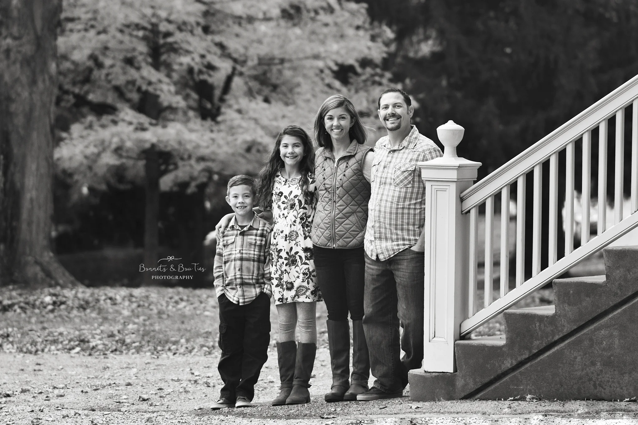 black and white portrait of family in the fall.jpg