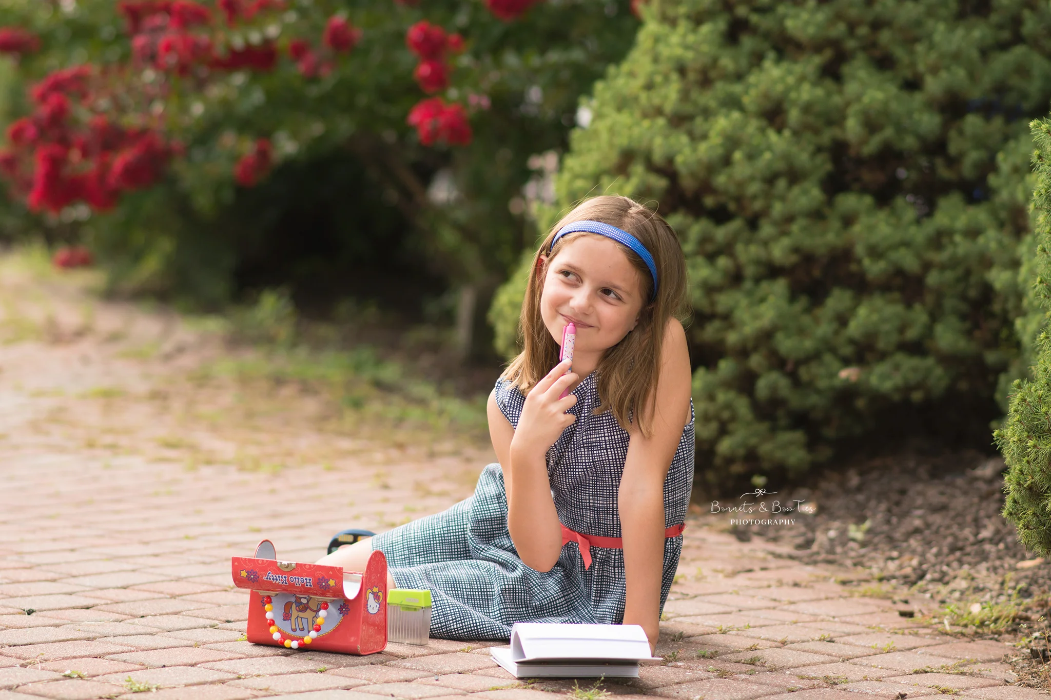 girl holding a pen.jpg