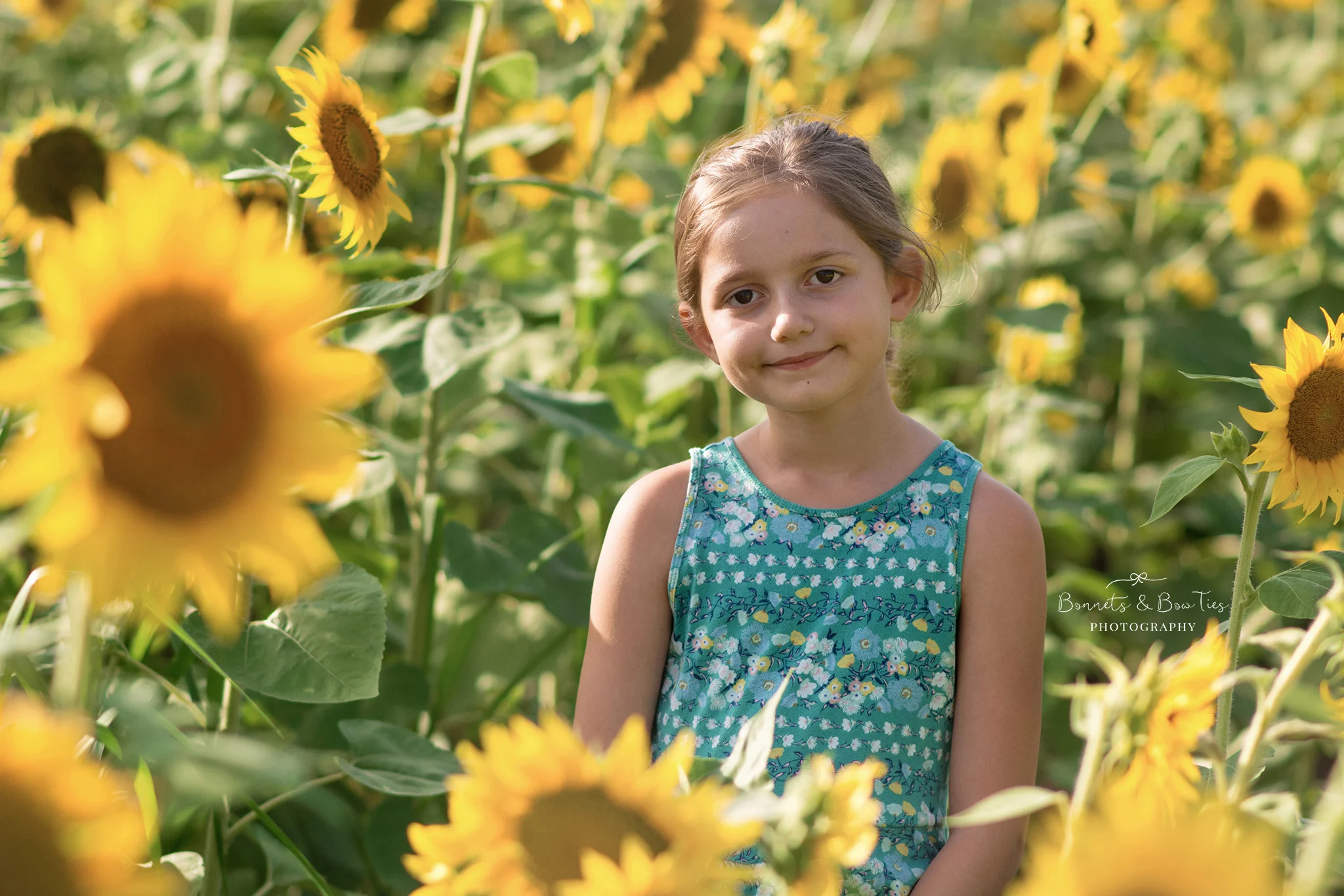 girl posing in sunflower field.jpg