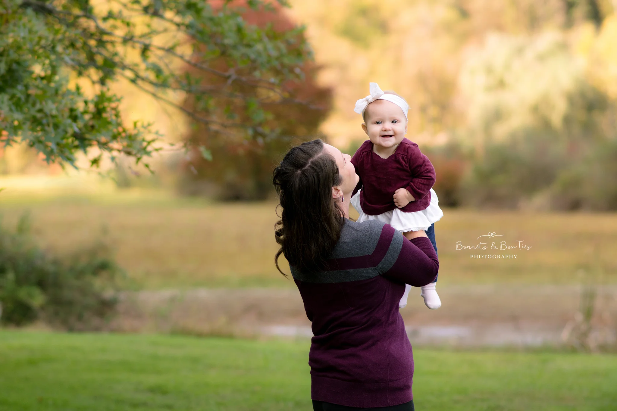Mom holding baby laughing.jpg