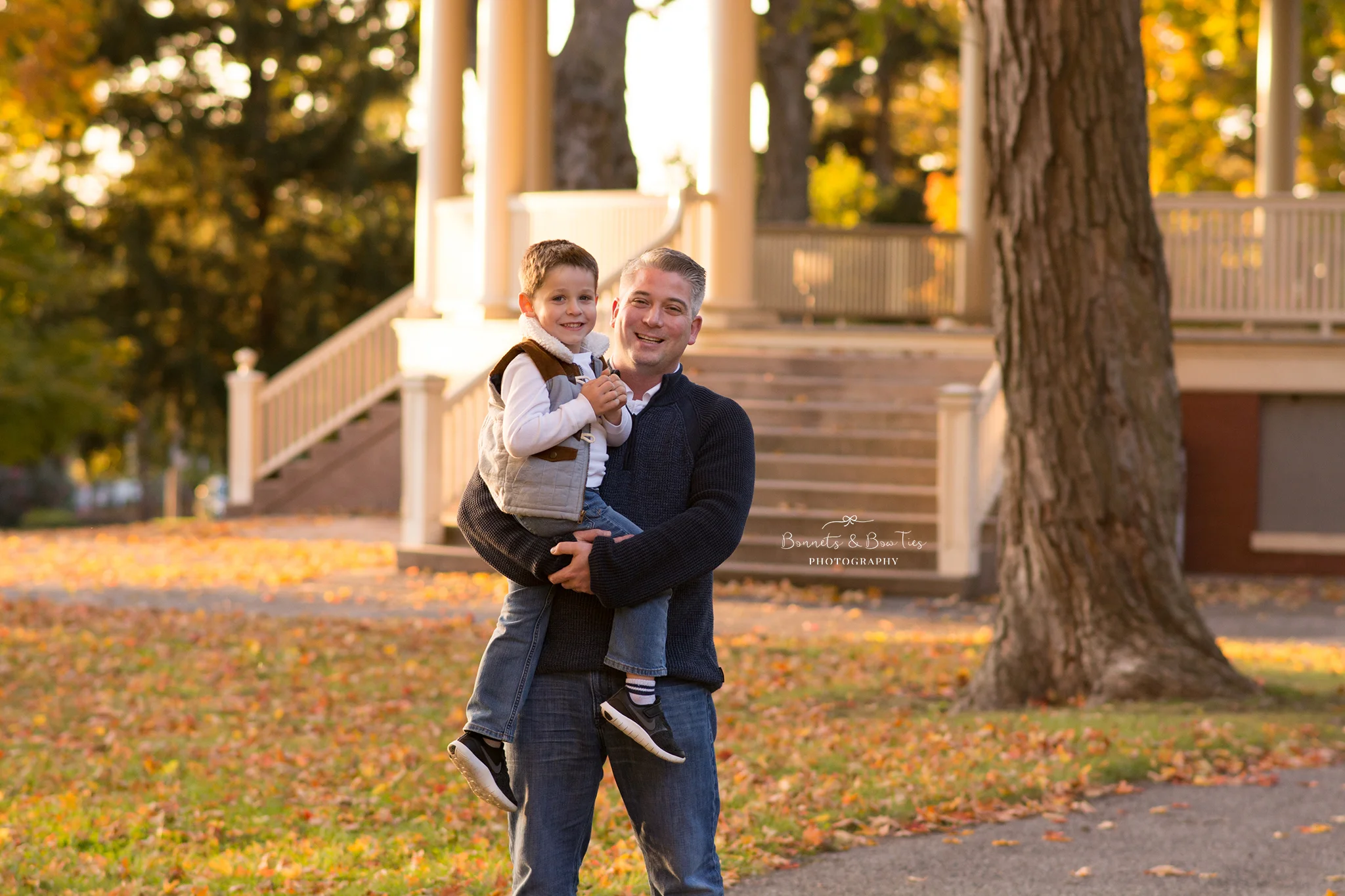 daddy and son pose near gazebo.jpg
