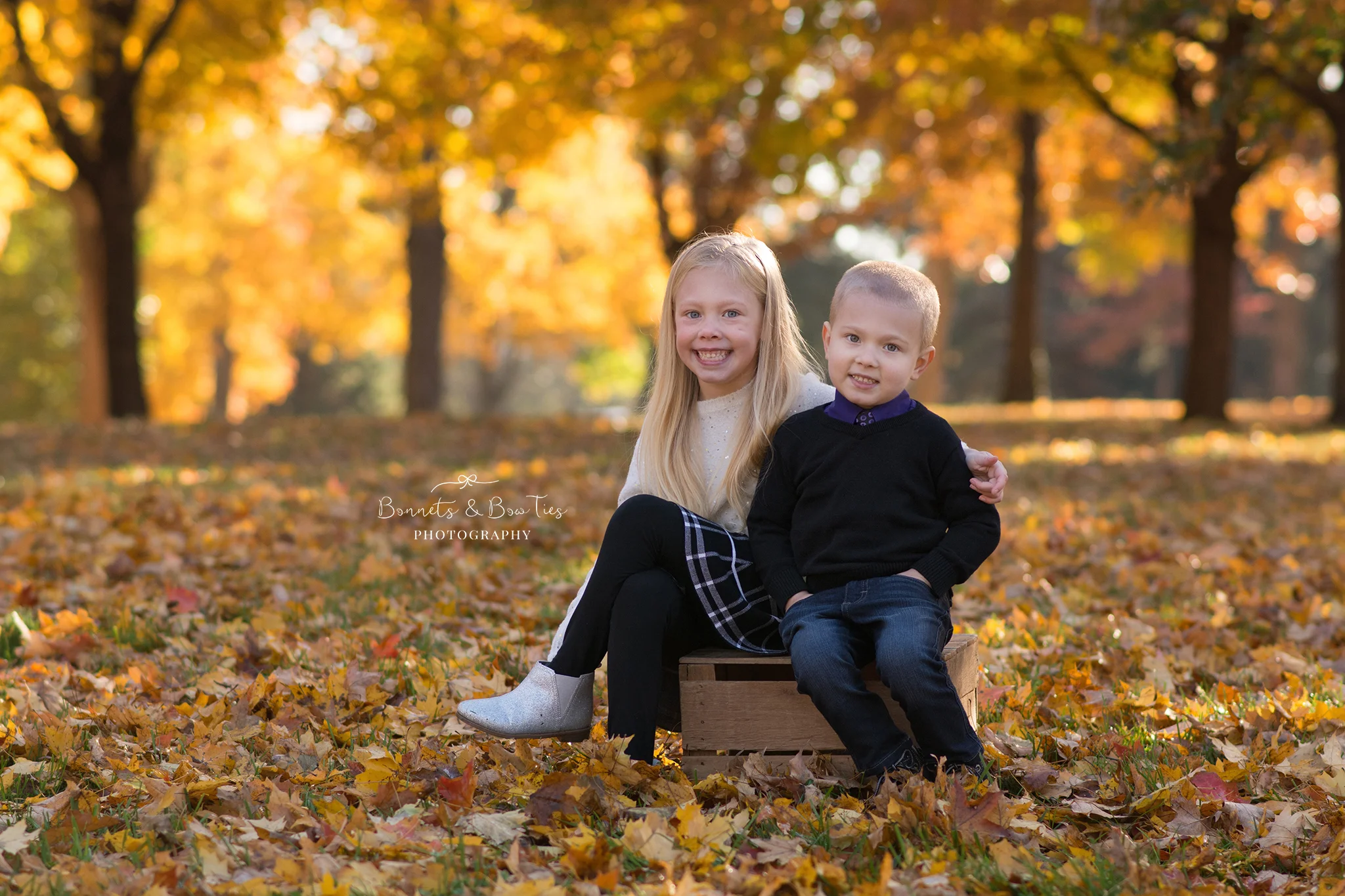 sibling pose during fall photo session.jpg