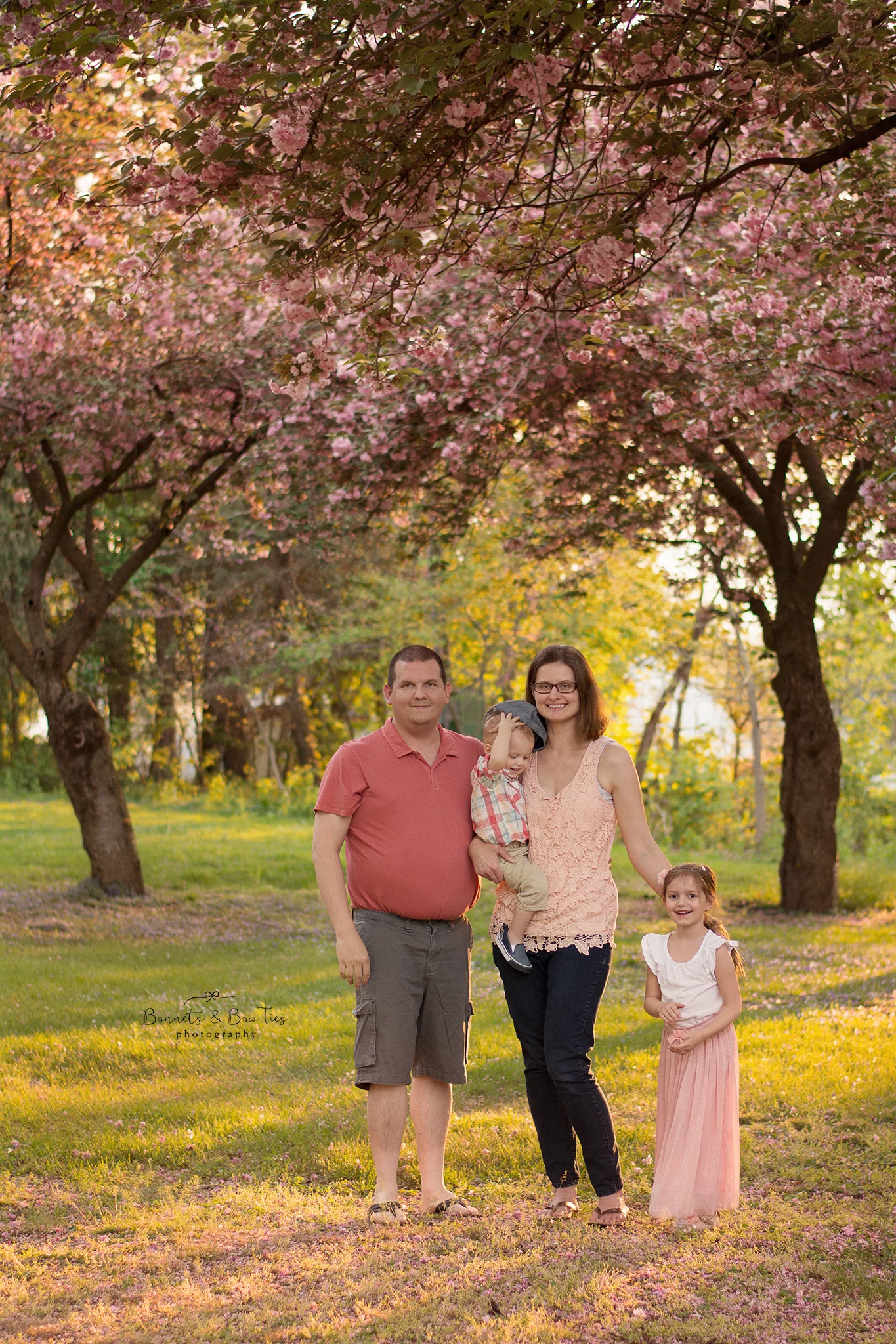 family session under tree with blossoms at farquhar park.jpg