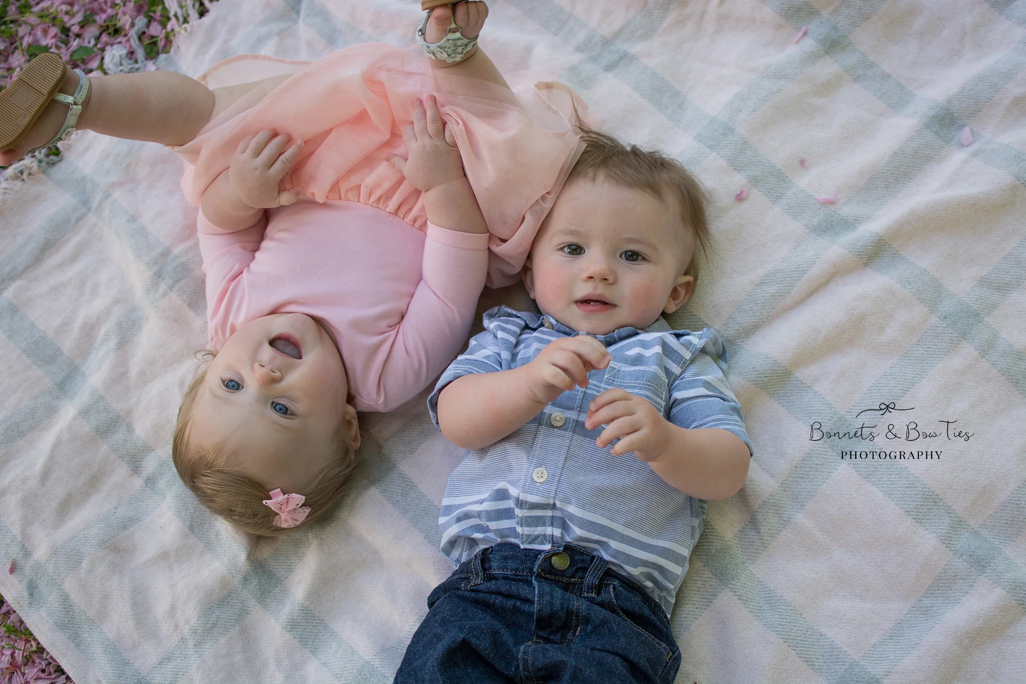 boy and girl twins laying on blanket.jpg