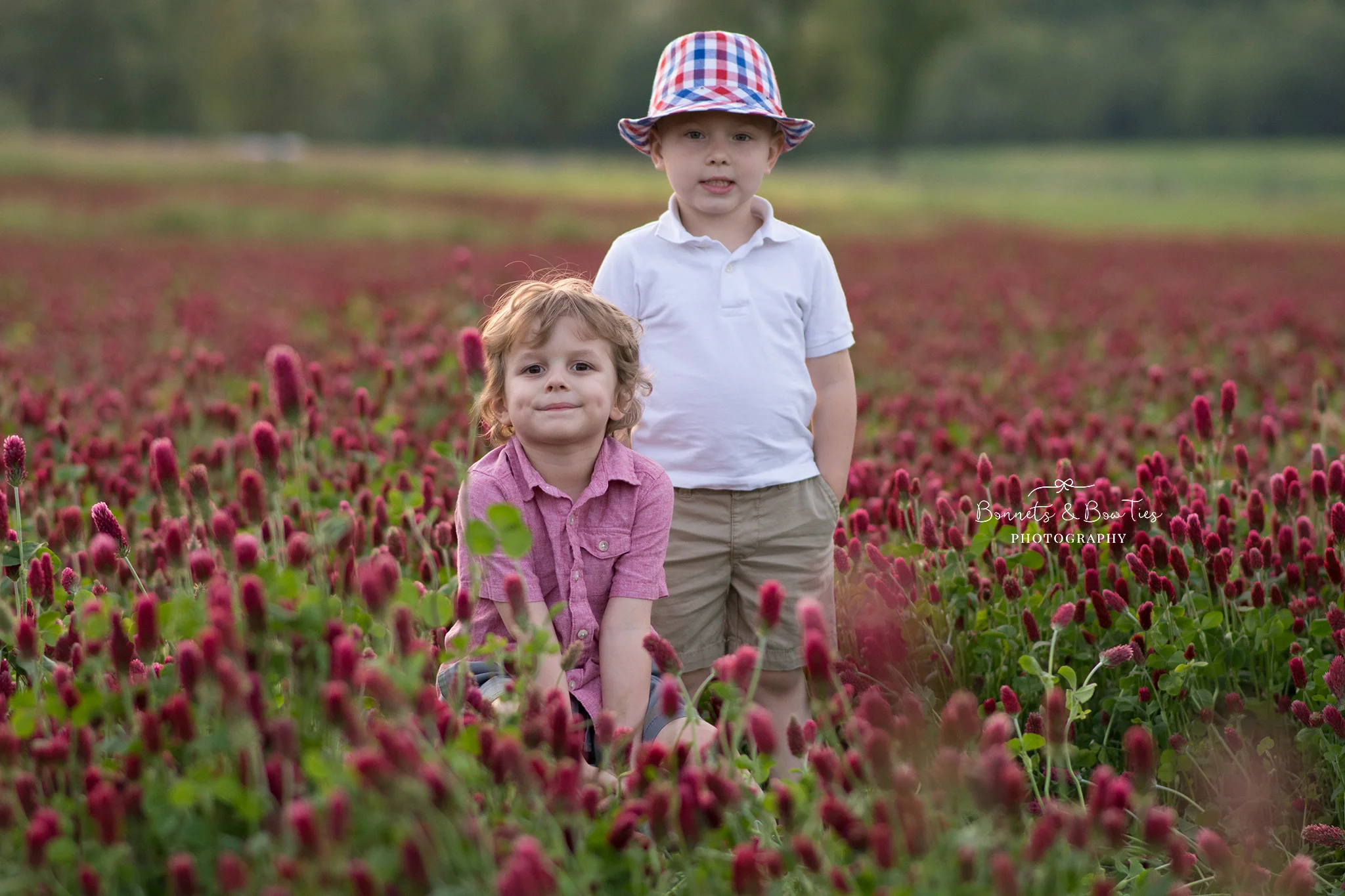 two boys pose in field.jpg