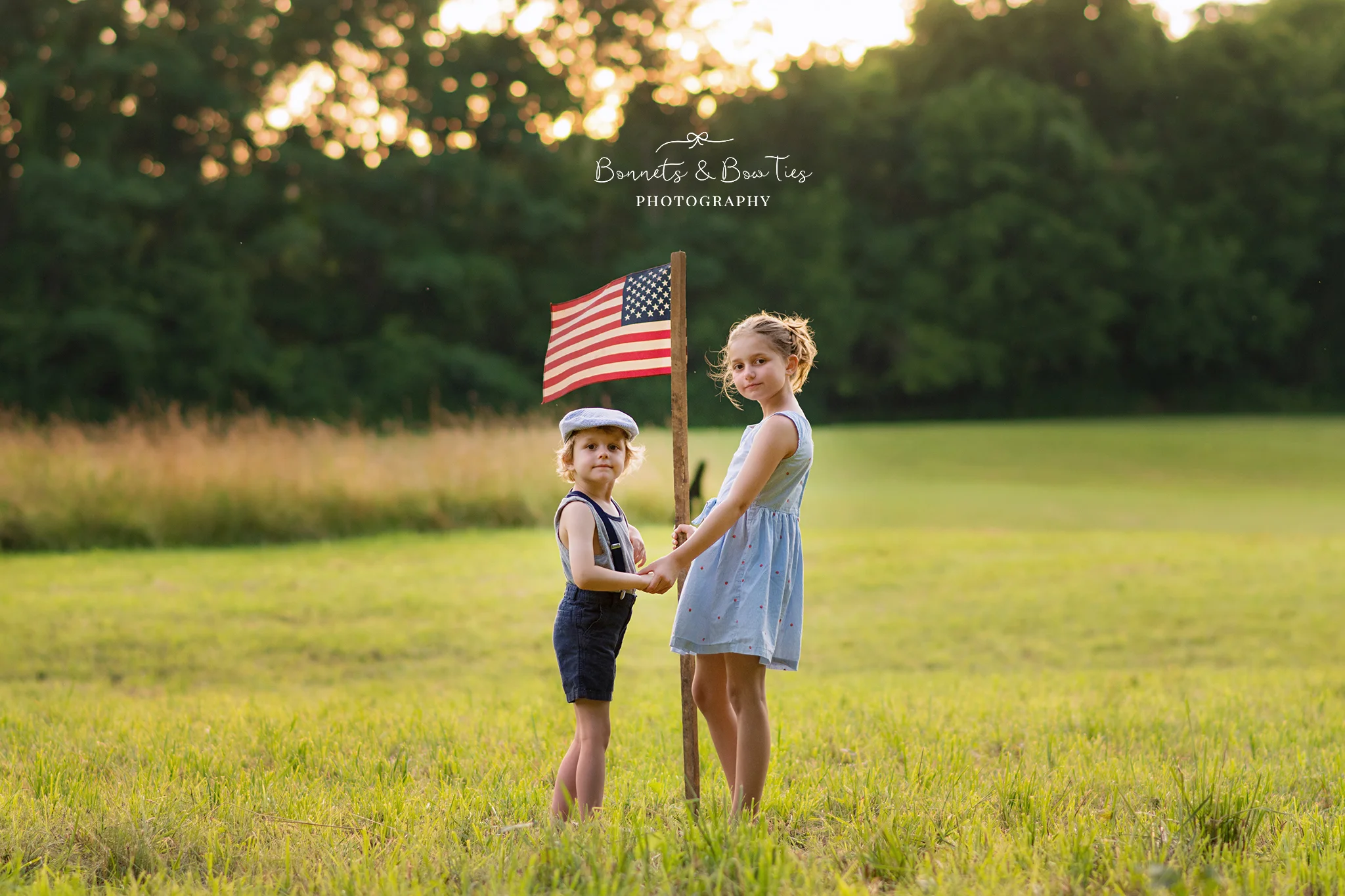 boy and girl pose with amercian flag.jpg