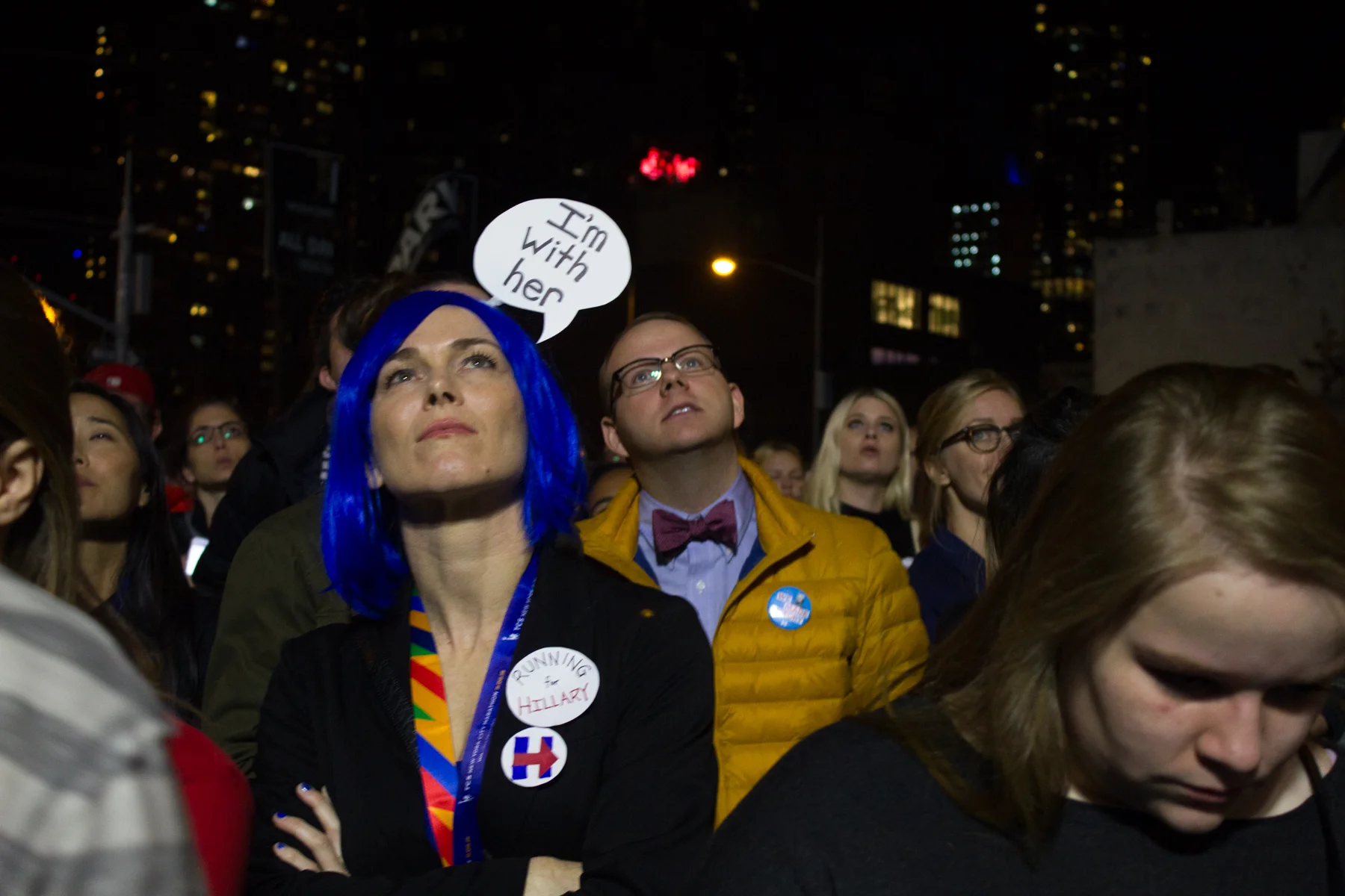 Niki Rarig, 34, looks on as poll results come in at the Javits Center. Rarig and a friend dressed up as the Clinton logo for Halloween (both wore all blue and carried a red arrow between them), and she decided that election night was a fitting time for a reprise.
