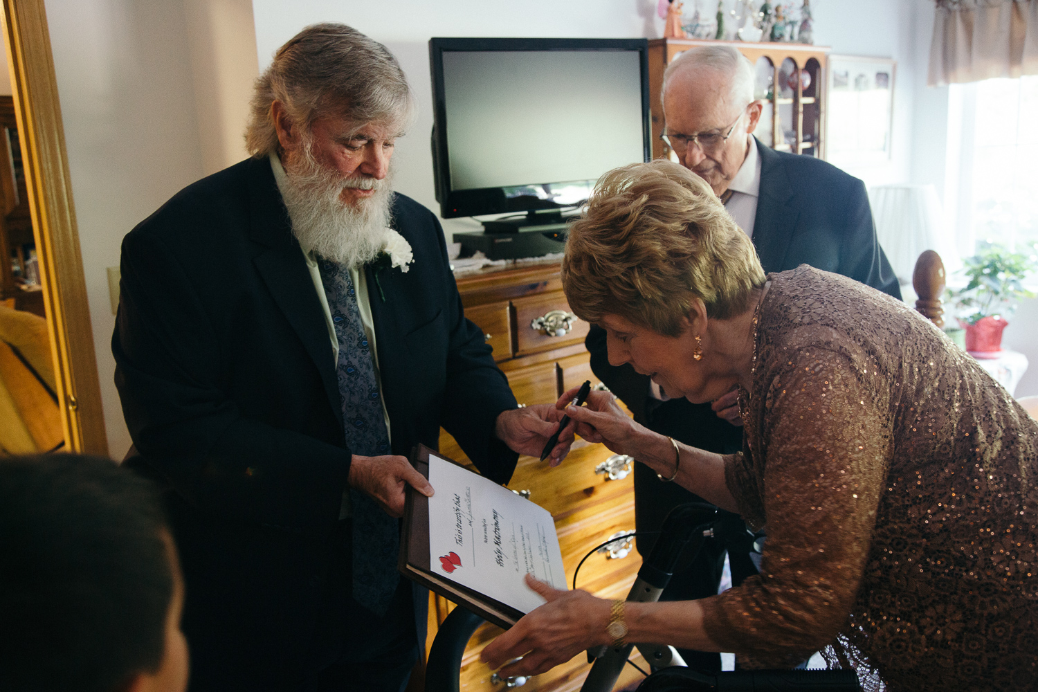 Signing their marriage license