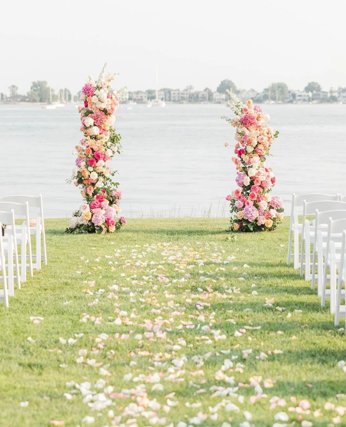 I&rsquo;ll never get sick of this beautiful floral design from the most colorful summer wedding at the stunning @theinnatlongshore.  Swipe to see a few of my (many, many) favorite details for this elegant celebration.⁠
⁠
Venue: @theinnatlongshore⁠
Ph