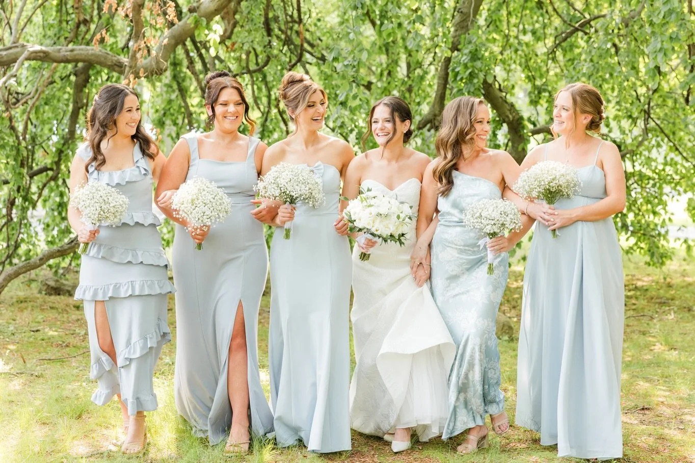 Your wedding party photos don&rsquo;t have to be stiff or rigid.  Laugh together, walk with your arms linked, and have fun with your closest people.  Swipe to see more of the wonderful group of people who surrounded Annie and Mike on their wedding da