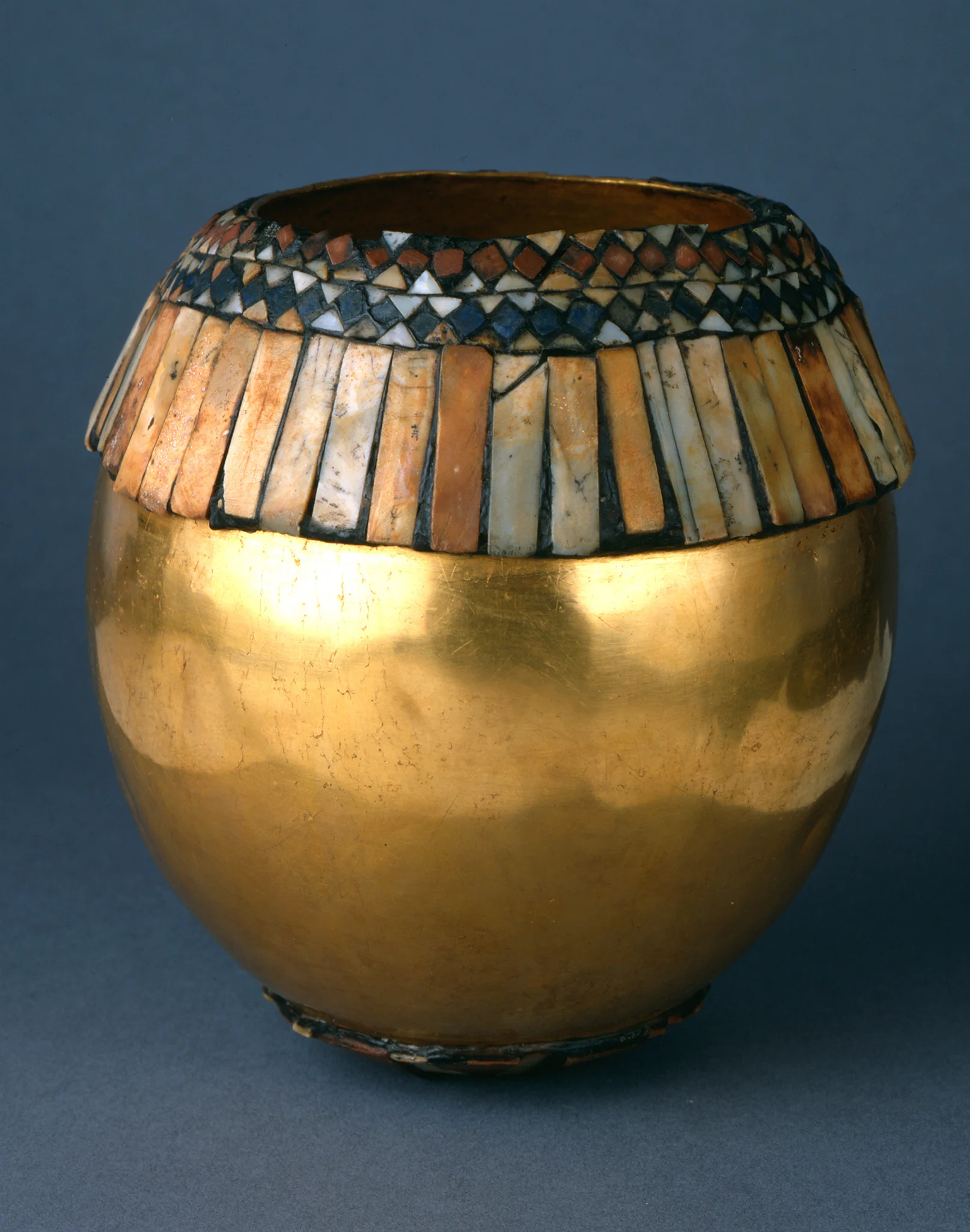 This gorgeous golden example (above), is via sumerianshakespere.com, and is inlaid with red limestone, shells, and lapis lazuli.