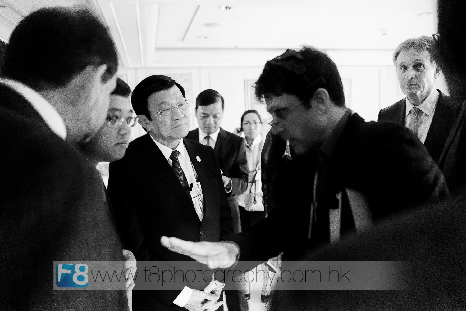 The President of ViETNAM Mr TrUOng TAn Sa and his team are briefed by production crew behind the stage before going in front of the crowd at apec 2015.