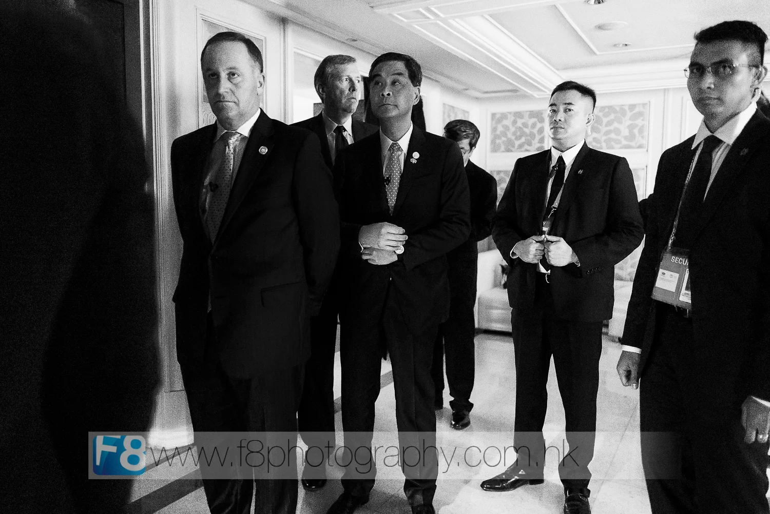 Prime Minister Of New Zealand mr john key (fronT left) and chief executive of hong kong mr CY LEUNG preparing to go on stage.  their two bodyguards keeping an eye on me whilst i work in the shadows...