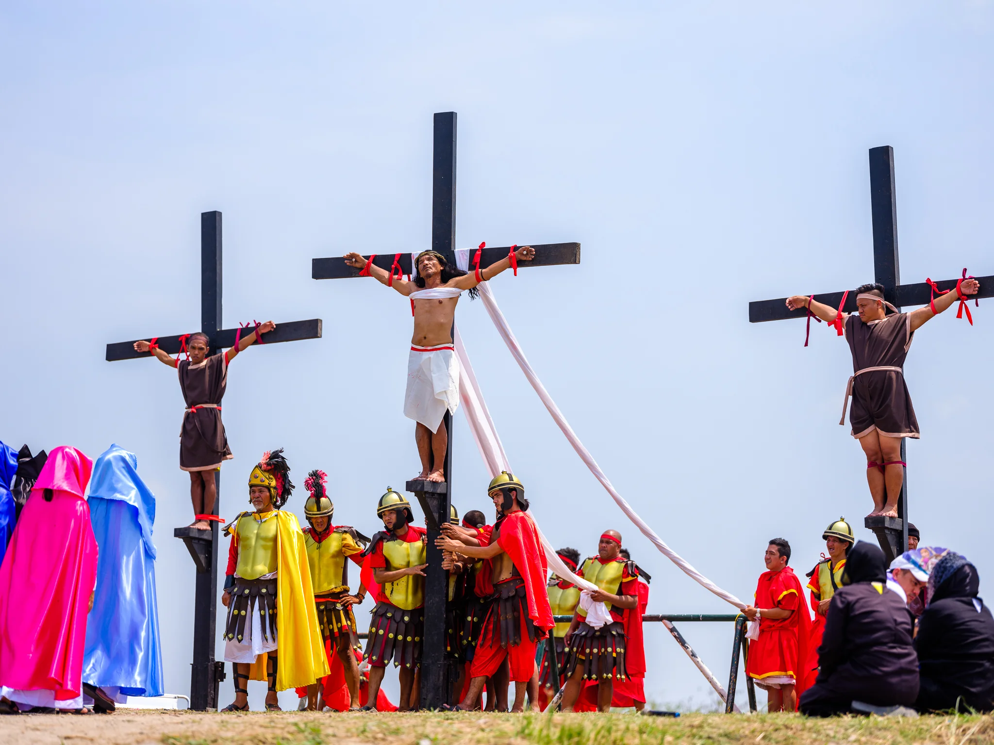 Ruben Enaje (CENTRE), a sign painter who began his yearly rite after surviving a fall from a building. This year was the 32nd time he has been crucified. Fuji GFX, 110mm.