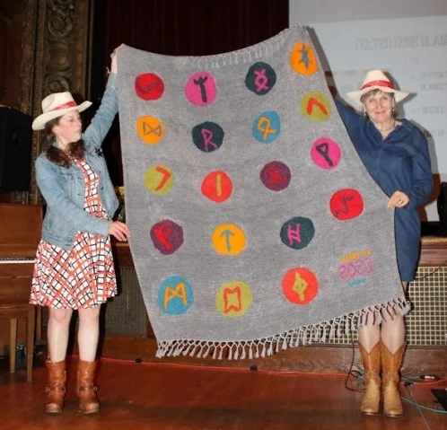 Felted rune blanket created and donated by the 4th grade for this year’s Live Auction.