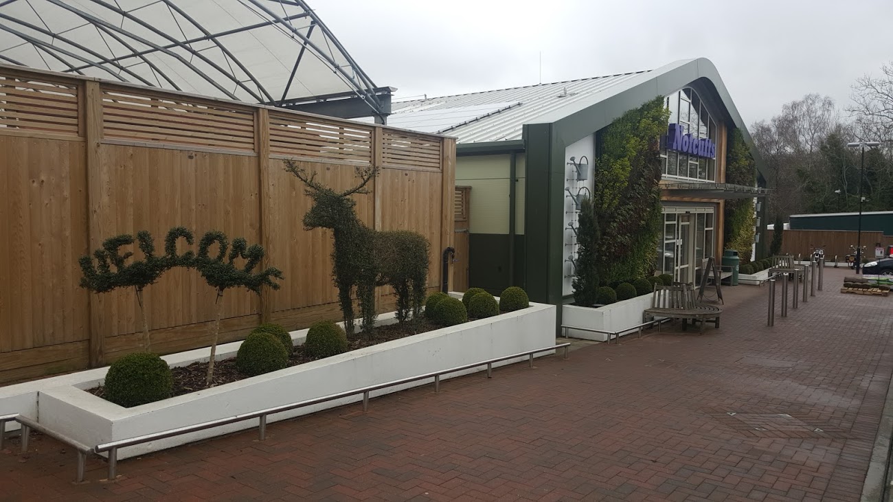 Two green walls by the entrance. Nice decoration with clear message: We make you green