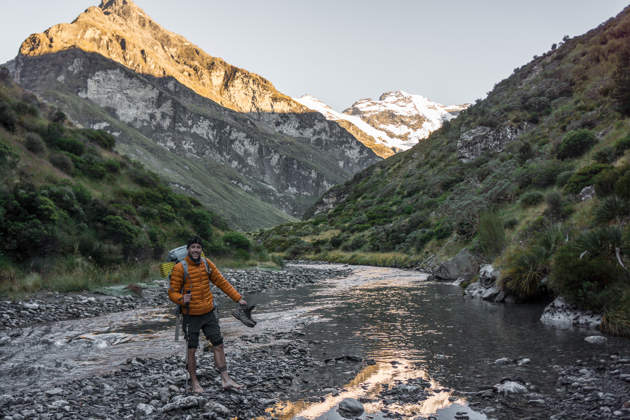 Tanguy fording the river to the rock bivvy