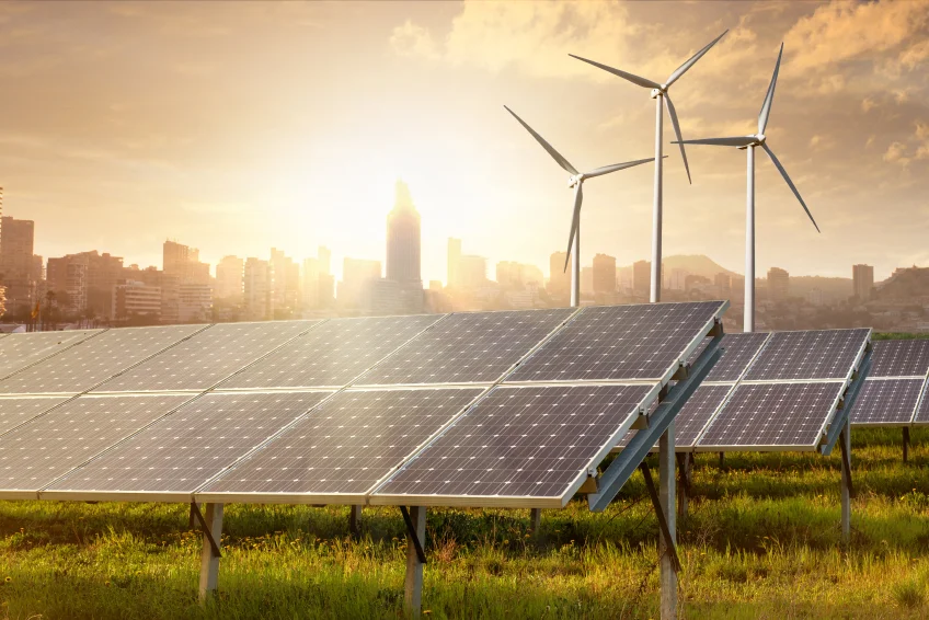 solar panels and wind generators against city view.jpg