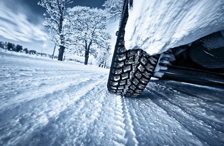 Car tyres on winter road