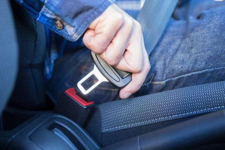 Close-Up-Of-Person-In-Car-Fastening-Seat-Belt.jpg