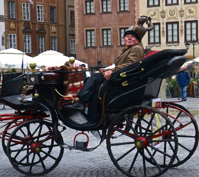 Chauffeuring the old-fashioned way. Warsaw, Poland.