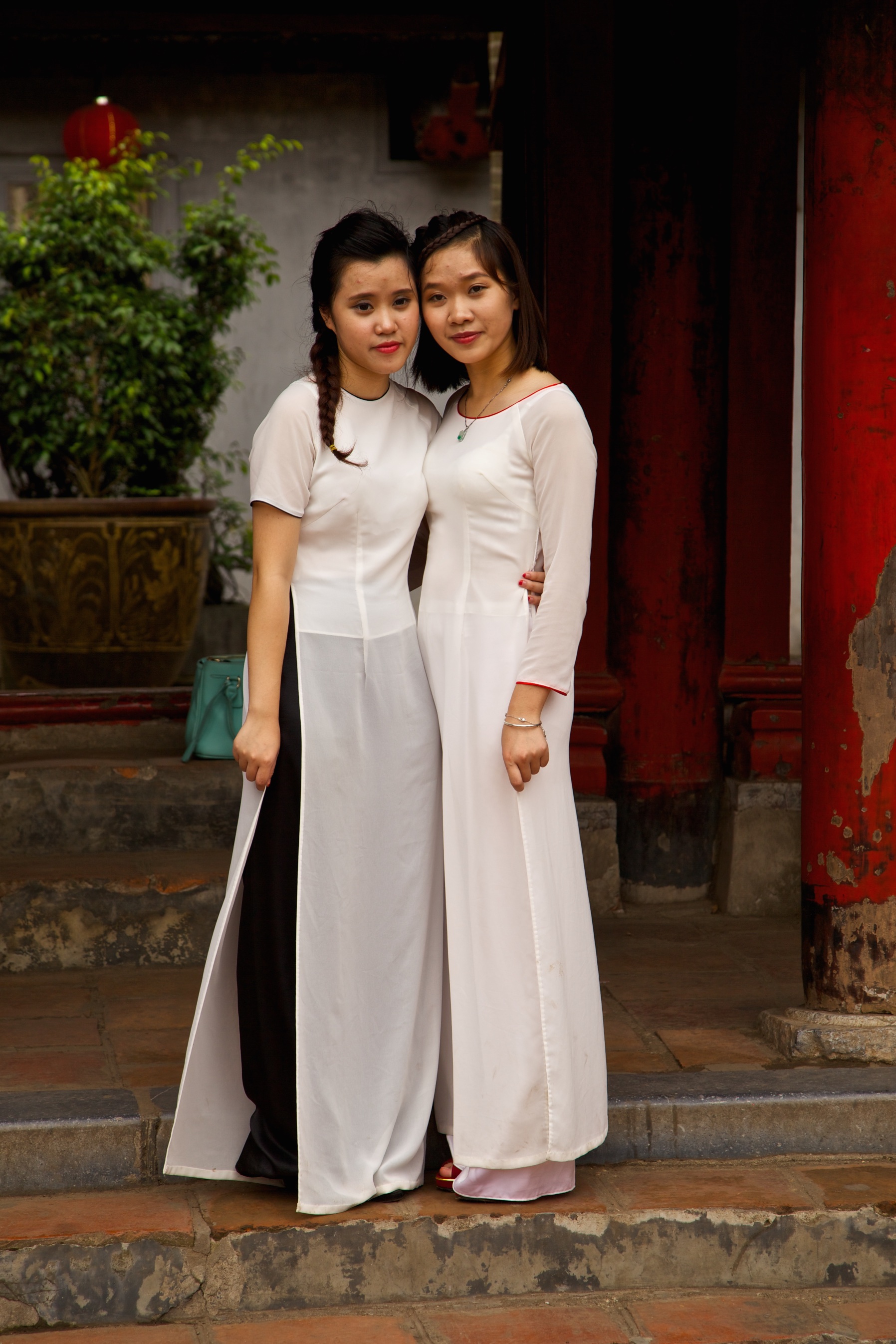 Friends visiting a local temple. Bali, Indonesia.