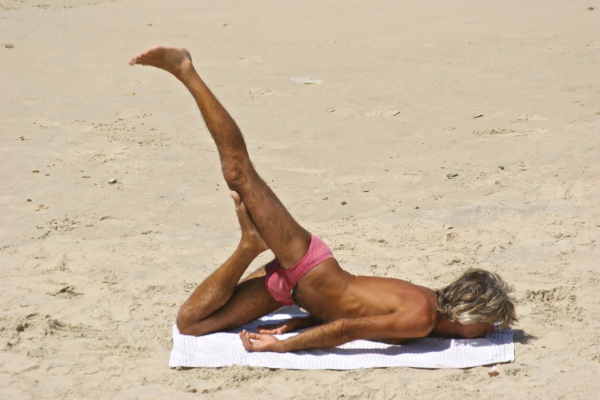 Yoga session on the beach. Tel Aviv, Israel.