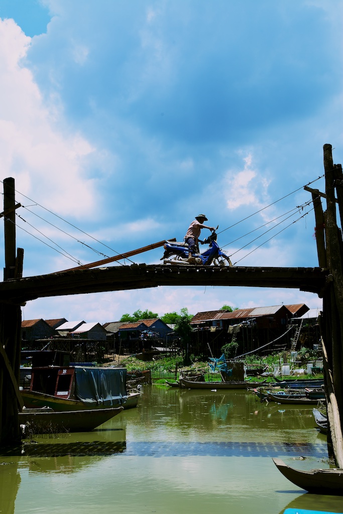 A fishing village's neck-breaking bridge. Cambodia.
