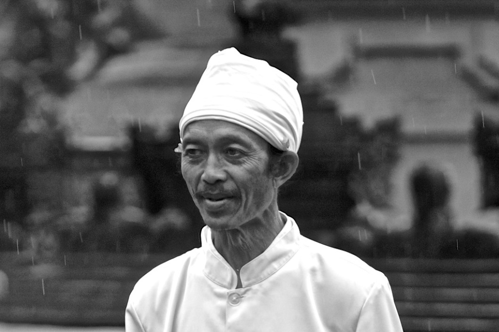 Lost in his thoughts as the rain starts. Bali, Indonesia.