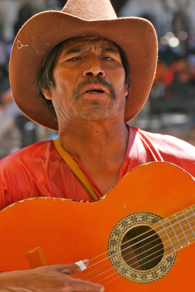 Singing for supper. Oaxaca, Mexico.