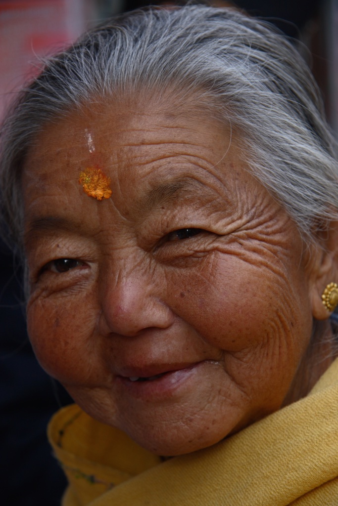 A glint in her eyes and a smile on her lips. Darjeeling, India.