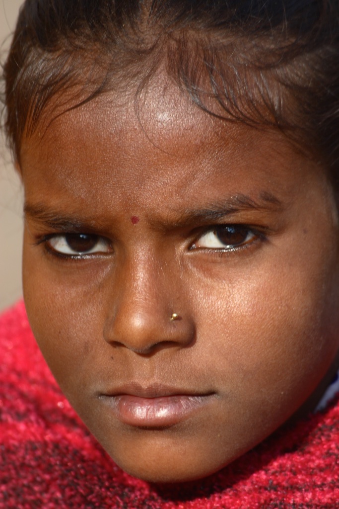 With determination in her eyes. India.