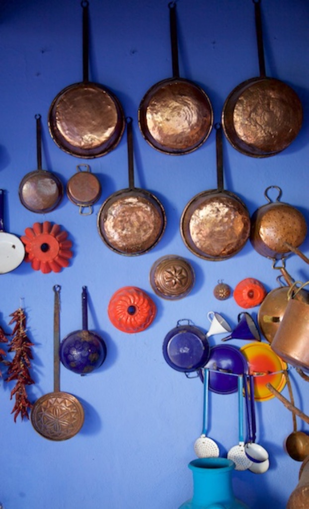 Pots and pans on a wall at Su Gologone, Sardinia.