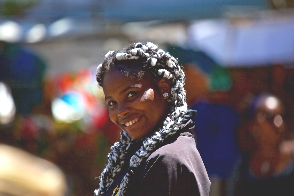 With black-and-white braids and a wide smile. Cape town, South Africa.
