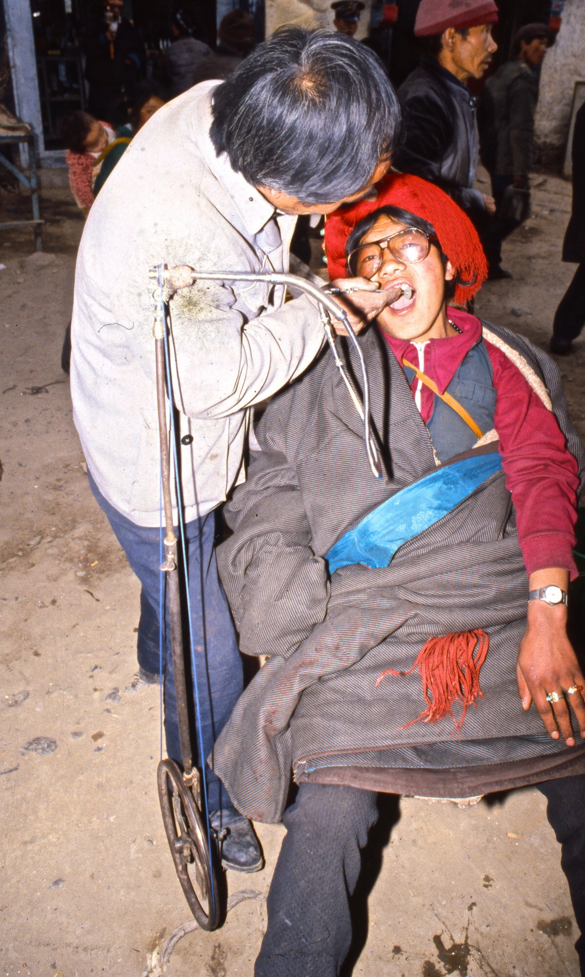 Street dentist at work. Lhasa, Tibet.