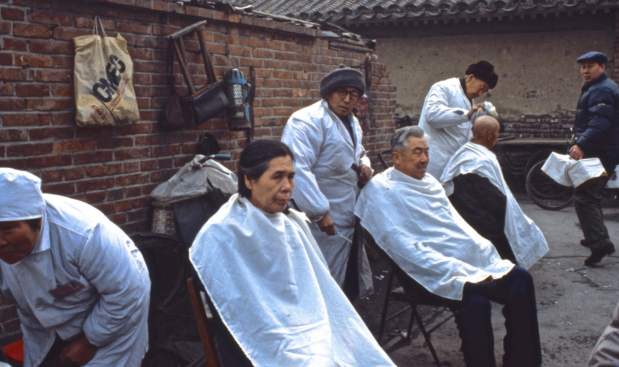 Open-air barber shop. Chongqing, China.