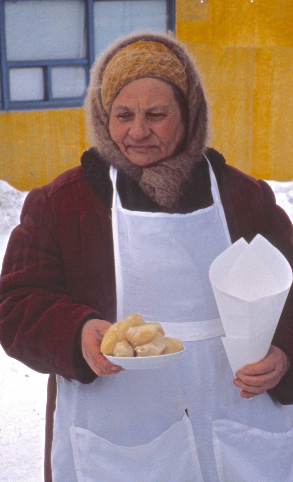 A Russian babushka selling hot potatoes at one of the railway stops for the Trans-Siberian train.