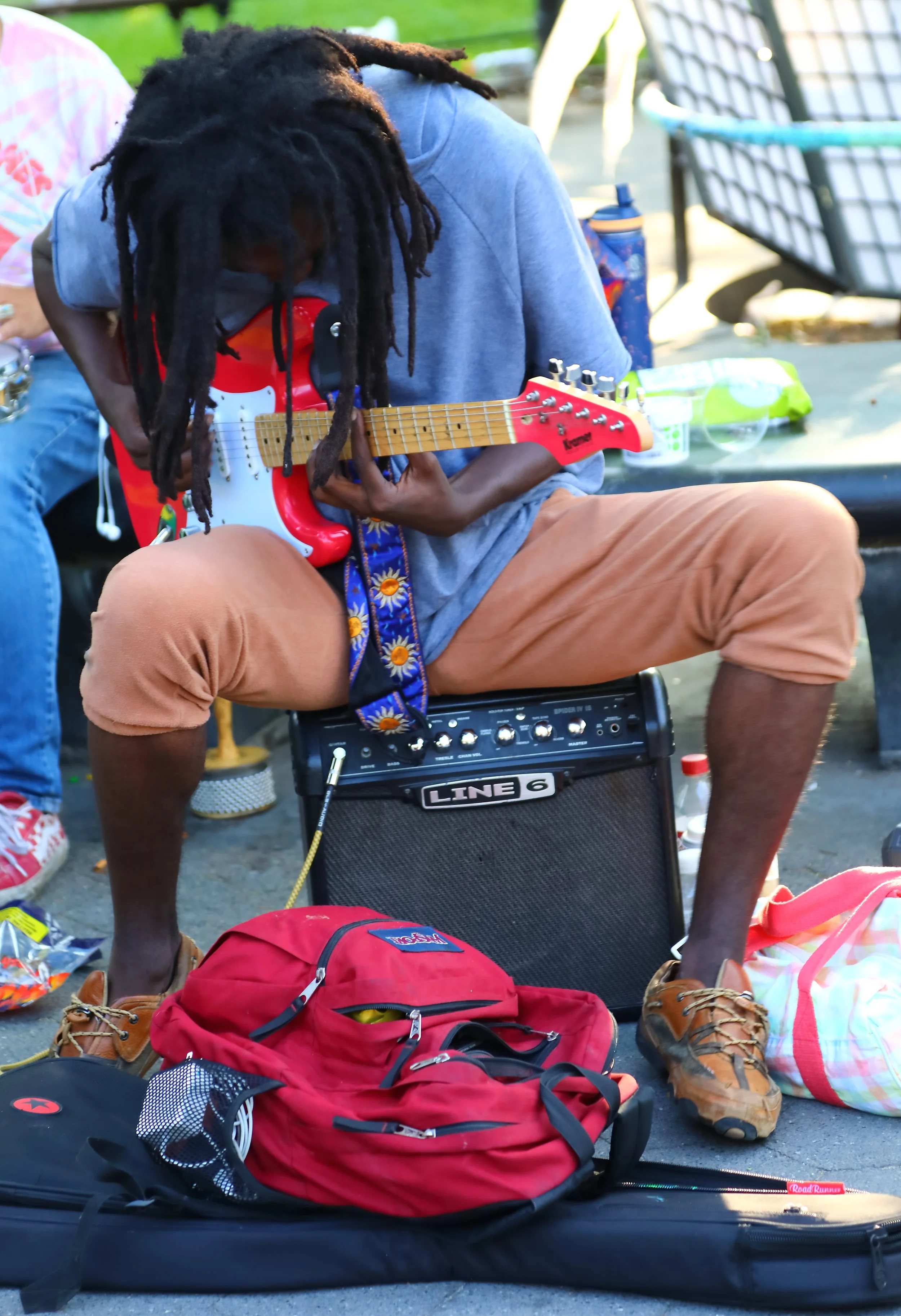 Flamboyant guitar virtuoso in Washington Square, New York City.
