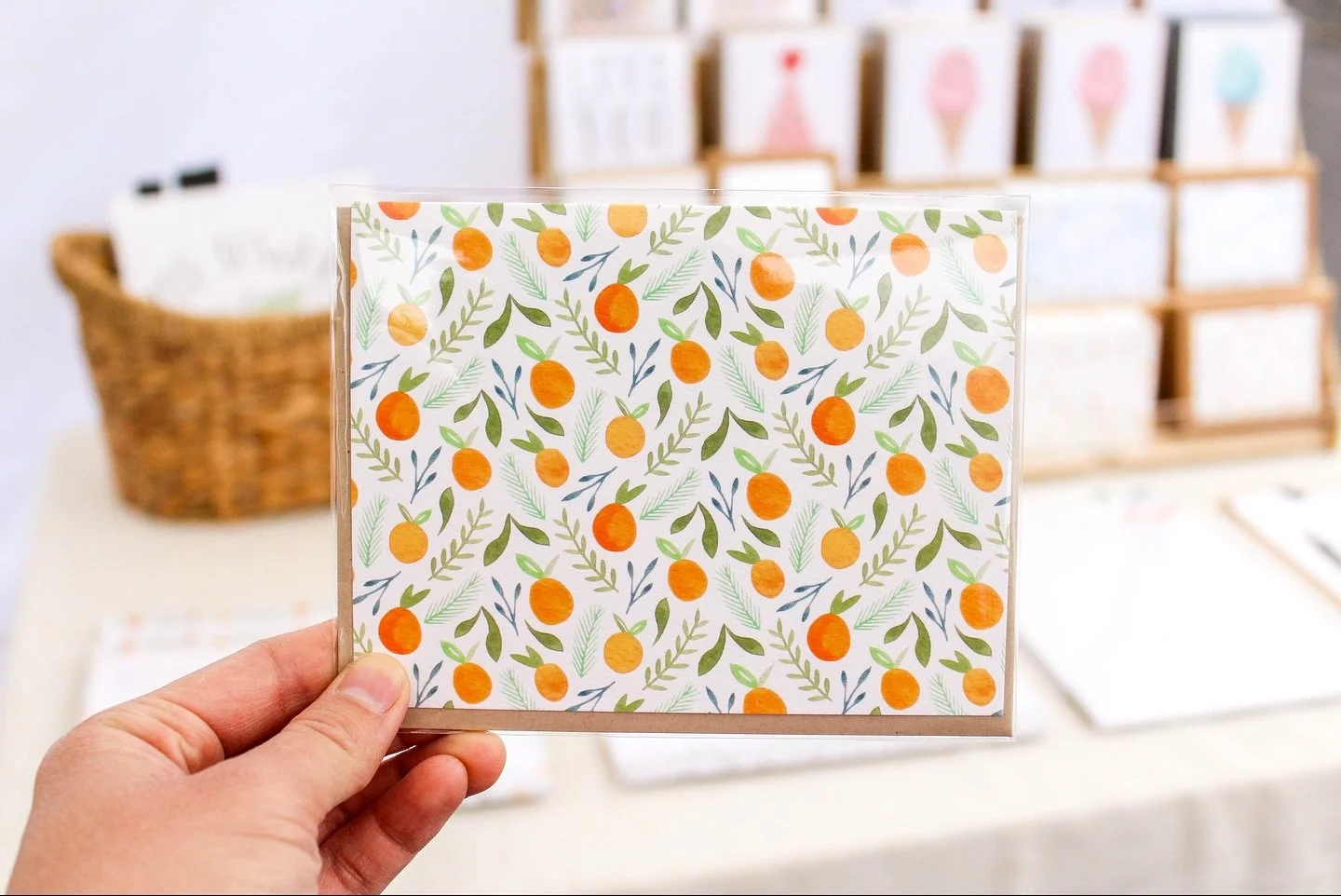 I&rsquo;m all set up at @orangehomegrown Farmers &amp; Artisans Market until 1pm today. Come shop in person for my second to last market before taking a short break before holiday season. I have my watercolor goods and gifts, including tea towels (pl